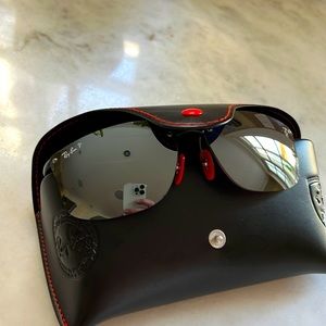 RayBan mens sunglasses.  Ferrari symbol on arm.  Never worn.